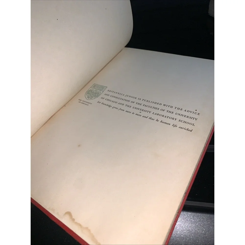 Volume 7 (H) of the vintage red and gold Britannica Junior Encyclopædia